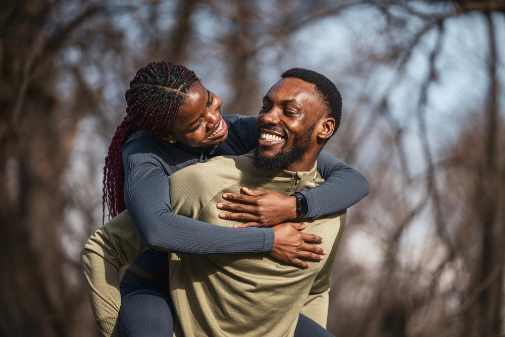 Two happy patients smiling together outdoors